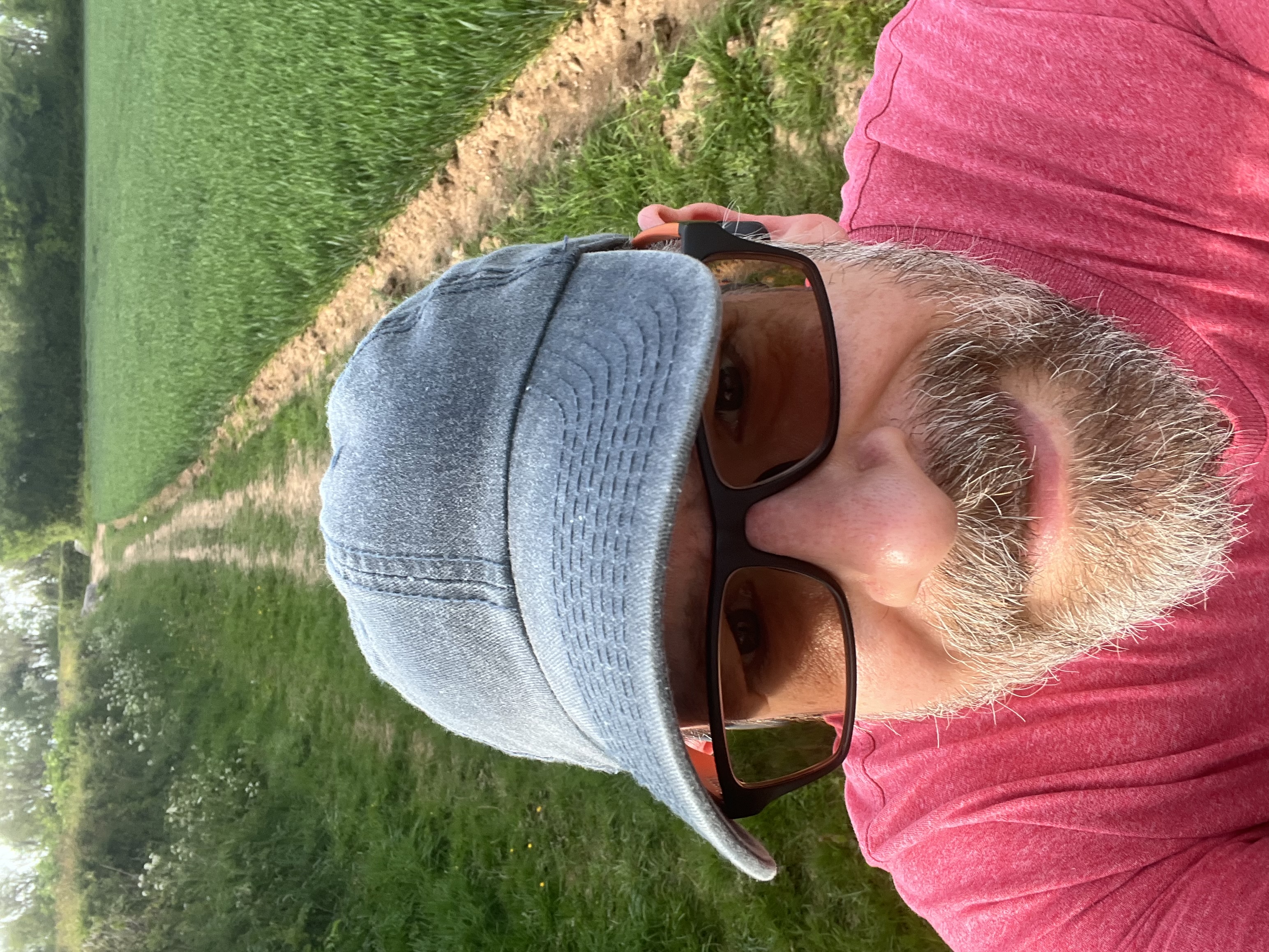 A selfie of me on a footpath across a field