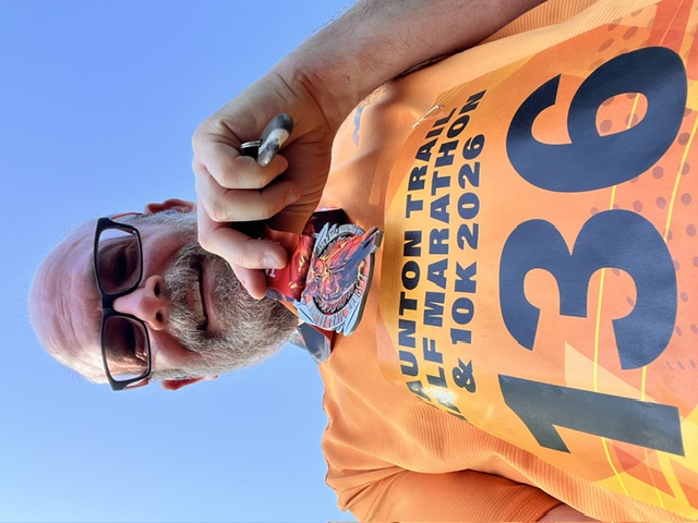 A photo of me after the race showing off my medal.